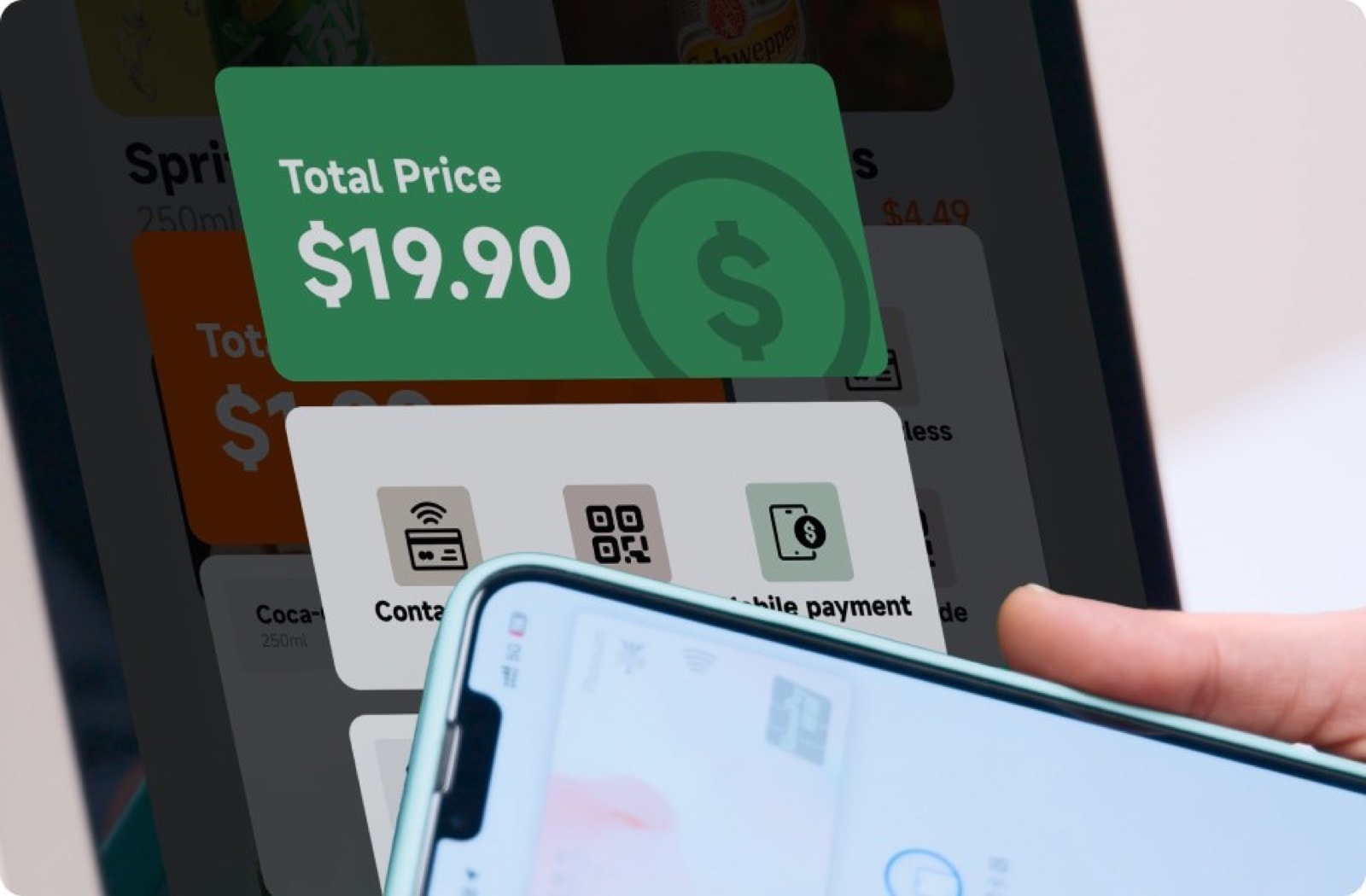 A phone held to a kiosk screen showing a total of $19.90 and contactless, QR and mobile payment options