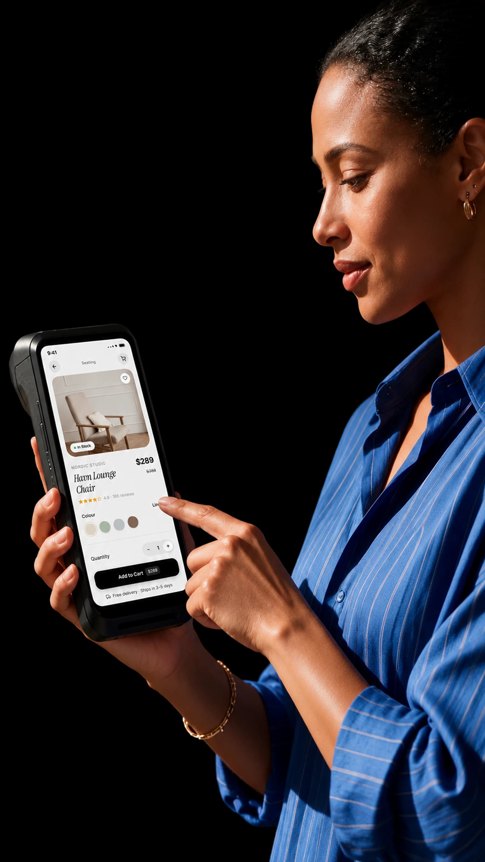 A woman in profile holding a handheld terminal in one hand, tapping its screen with the other; the screen shows a lounge chair product page with an Add to Cart button